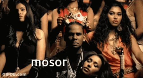 A Group Of Women Sitting Around A Man With The Word Mosor On The Bottom Right GIF