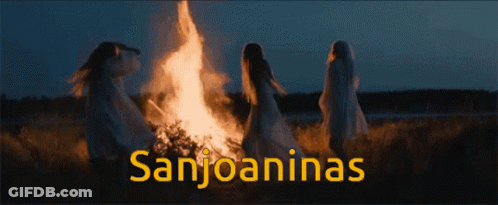 A Group Of Women Standing Around A Fire With The Words Sanjoaninas On The Bottom GIF