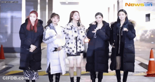 A Group Of Women Standing Next To Each Other With The Newsen Logo On The Bottom Right GIF
