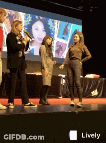 A Group Of Women Standing On A Stage With The Word Lively On The Bottom Right GIF