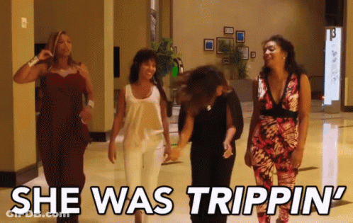 A Group Of Women Walking Down A Hallway With The Words She Was Trippin ' GIF