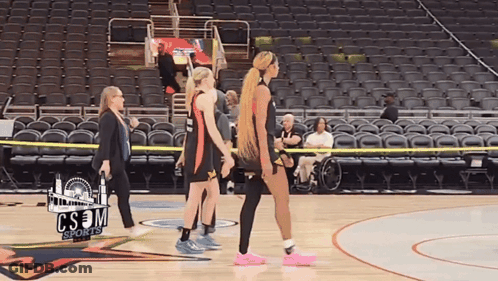 A Group Of Women Walking On A Basketball Court With Cs3m Sports Written On The Bottom GIF