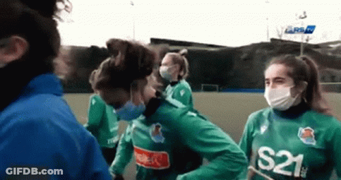 A Group Of Women Wearing Face Masks And S21 Jerseys GIF