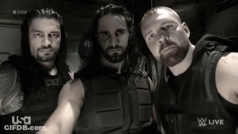 A Group Of Wrestlers Are Posing For A Picture In Front Of A U-S-A Logo GIF