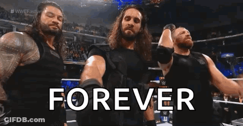 A Group Of Wrestlers Standing Next To Each Other In A Ring With The Words `` Forever '' . GIF