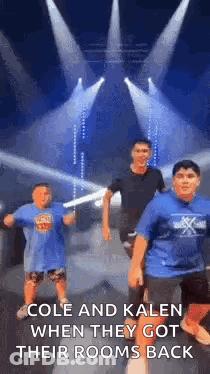 A Group Of Young Boys Are Dancing On A Stage In Front Of A Stage . GIF