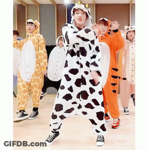 A Group Of Young Boys Are Dressed In Animal Costumes Including A Giraffe And A Tiger GIF