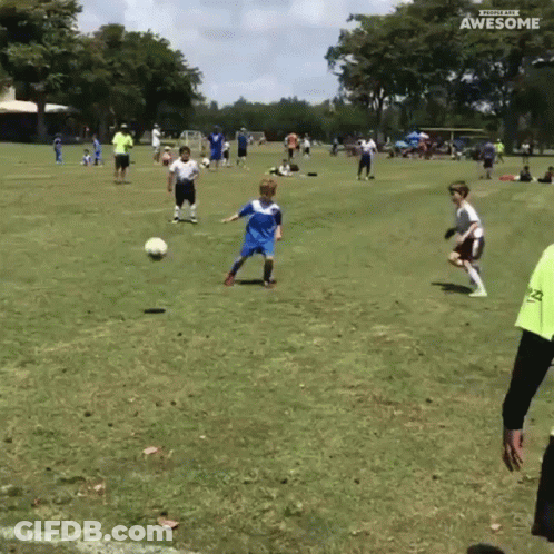 A Group Of Young Boys Are Playing Soccer On A Field With The Words Awesome On The Bottom Right GIF