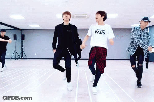 A Group Of Young Men Are Dancing In A Dance Studio And One Of Them Is Wearing A Vans T-Shirt GIF