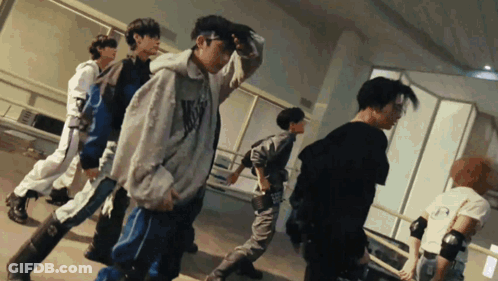 A Group Of Young Men Are Dancing In A Room And One Of Them Is Wearing A Hoodie That Says N.y.c. GIF