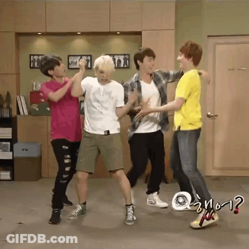 A Group Of Young Men Are Dancing In A Room And One Of Them Is Wearing A Yellow Shirt That Says ? GIF