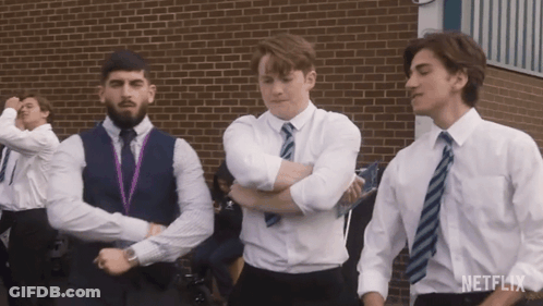 A Group Of Young Men Are Dancing In Front Of A Brick Building And The Word Netflix Is On The Bottom GIF