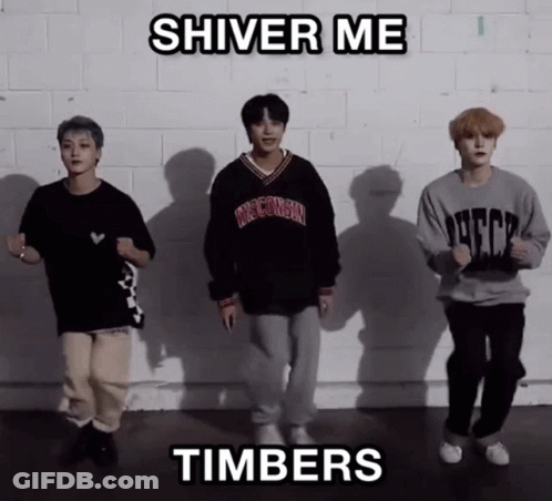 A Group Of Young Men Are Dancing In Front Of A Brick Wall With The Words Shiver Me Timbers Above Them GIF