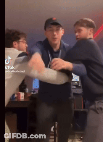 A Group Of Young Men Are Fighting In A Room With Tiktok Written On The Bottom Right GIF
