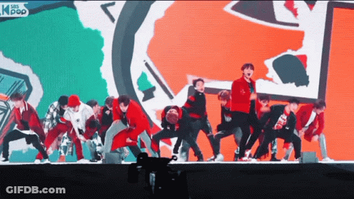 A Group Of Young Men Are Performing On A Stage With Asian Pop Written On The Bottom GIF