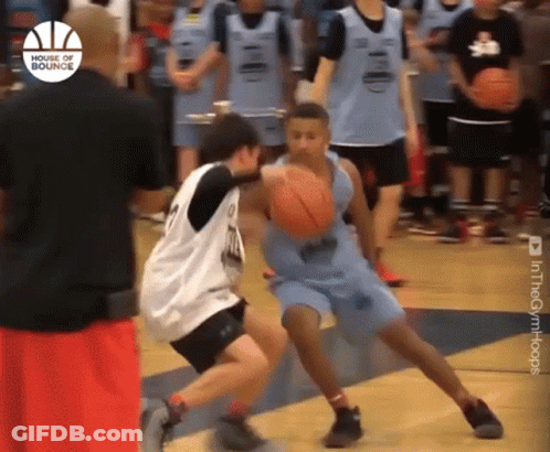 A Group Of Young Men Are Playing Basketball And One Of Them Is Wearing A Jersey That Says ' House Of Bounce ' On It GIF