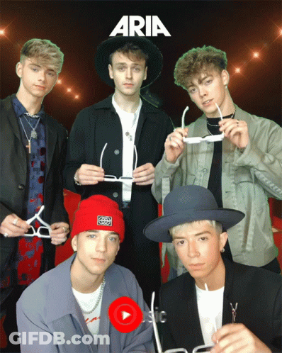A Group Of Young Men Are Posing For A Photo With Aria Written On The Top GIF