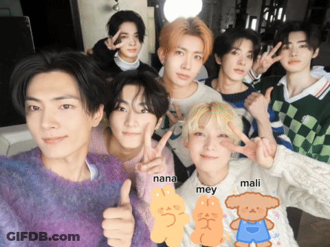 A Group Of Young Men Are Posing For A Picture And One Of Them Has The Name Nana On His Shirt GIF