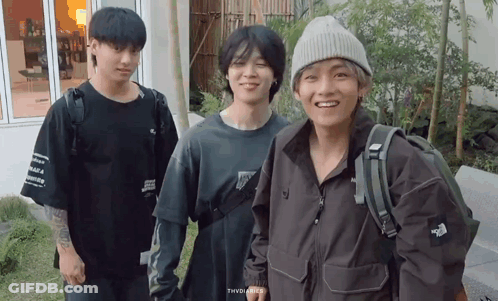 A Group Of Young Men Are Posing For A Picture And One Of Them Is Wearing A North Face Jacket GIF