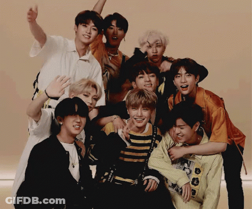 A Group Of Young Men Are Posing For A Picture And One Of Them Is Wearing A Shirt That Says ' I Love You ' GIF