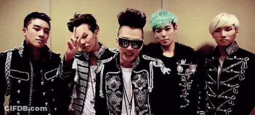 A Group Of Young Men Are Posing For A Picture And One Of Them Is Wearing Sunglasses GIF