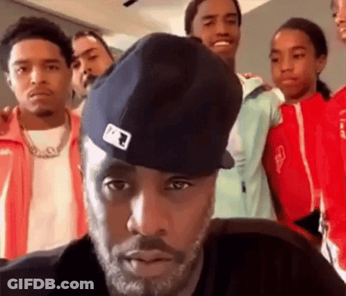 A Group Of Young Men Are Posing For A Picture Together . GIF