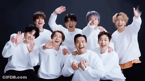 A Group Of Young Men Are Posing For A Picture Together GIF