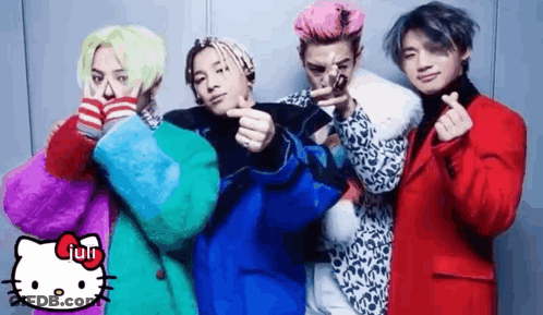 A Group Of Young Men Are Posing For A Picture With A Hello Kitty . GIF