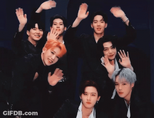 A Group Of Young Men Are Posing For A Picture With Their Hands Up GIF