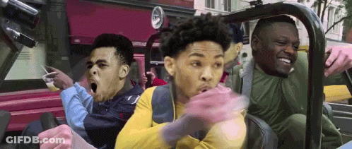 A Group Of Young Men Are Riding In A Car With Their Mouths Open . GIF