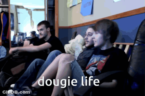 A Group Of Young Men Are Sitting On A Couch With The Words Dougie Life Written On The Bottom GIF