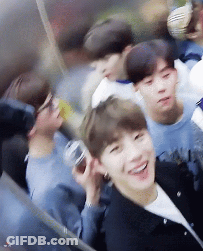 A Group Of Young Men Are Sitting On A Ferris Wheel And Smiling . GIF