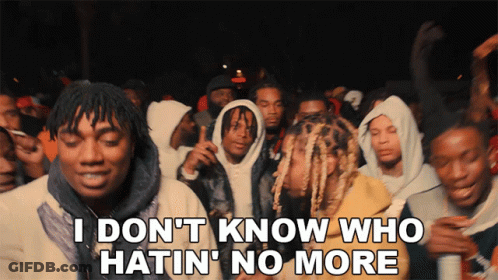 A Group Of Young Men Are Standing In A Crowd With The Words I Don 'T Know Who Hatin ' No More GIF
