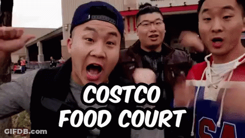 A Group Of Young Men Are Standing In Front Of A Costco Food Court Sign GIF