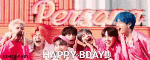 A Group Of Young Men Are Standing Next To Each Other And Laughing In Front Of A Sign That Says `` Happy Bday '' . GIF