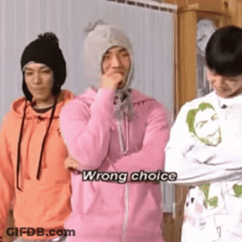 A Group Of Young Men Are Standing Next To Each Other And One Of Them Is Wearing A Pink Hoodie And A Hat . GIF