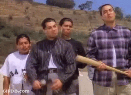 A Group Of Young Men Are Standing Next To Each Other Holding Baseball Bats And Guns . GIF