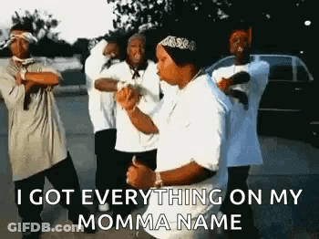 A Group Of Young Men Are Standing Next To Each Other In A Parking Lot And Dancing . GIF