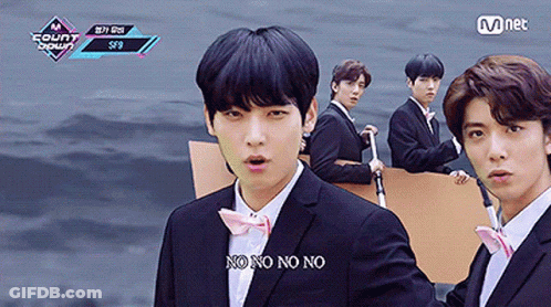 A Group Of Young Men In Suits And Bow Ties Are Standing Next To Each Other And One Of Them Is Saying No No No GIF