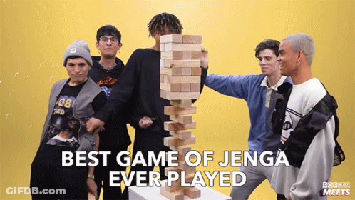 A Group Of Young Men Playing Jenga With The Words Best Game Of Jenga Ever Played Above Them GIF