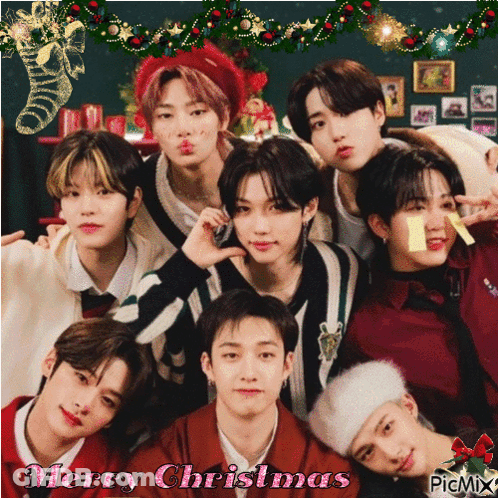 A Group Of Young Men Posing For A Picture With The Words Merry Christmas Written On The Bottom GIF