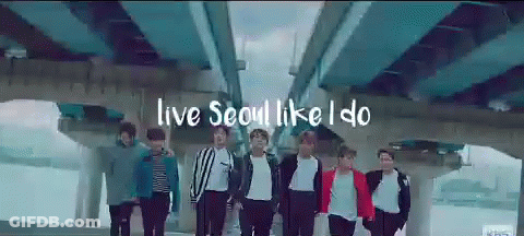 A Group Of Young Men Standing Under A Bridge With The Words Live Seoul Like I Do GIF