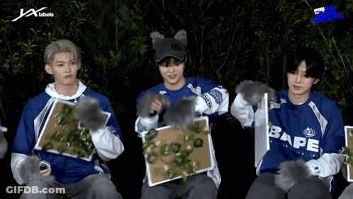 A Group Of Young Men Wearing Blue Shirts With Bape Written On Them GIF