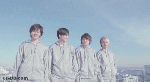 A Group Of Young Men Wearing Nike Sweatshirts Stand In A Row GIF