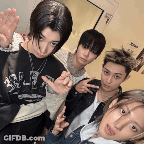 A Group Of Young People Are Posing For A Picture And One Of Them Is Wearing A Shirt That Says ' Shark ' On It GIF