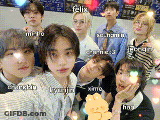 A Group Of Young People Are Posing For A Picture With Felix In The Center GIF