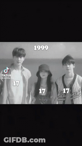 A Group Of Young People Standing Next To Each Other With The Year 1999 On The Bottom Of The Screen GIF