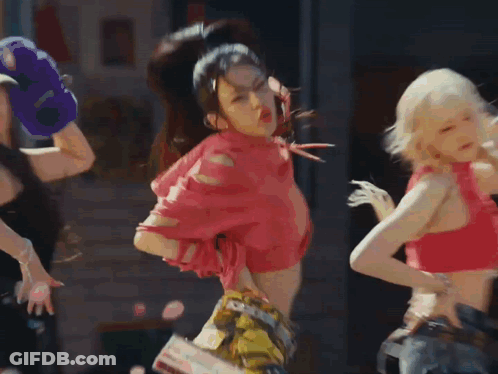 A Group Of Young Women Are Dancing In Front Of A Record Shop GIF