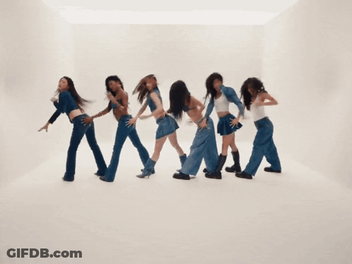 A Group Of Young Women Are Dancing Together And One Of Them Is Wearing A White Tank Top GIF