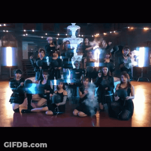 A Group Of Young Women Are Posing For A Picture In Front Of A Pyramid GIF